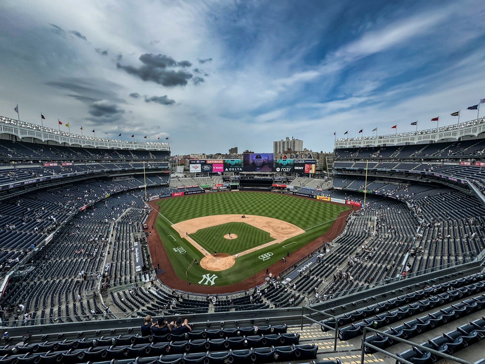 Yankee stadium sits empty on a cloudy day.